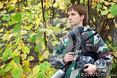 Paintball player looks aside Stock Photo