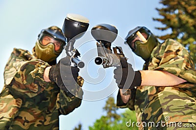 Paintball players with guns Stock Photo