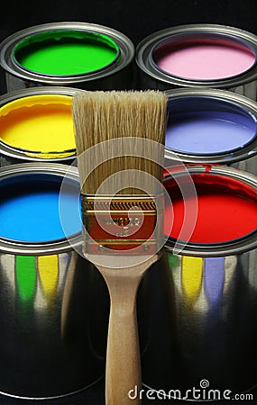 Paintbrush and Paint, Cans of Primary Colored Paints on Black Ba Stock Photo