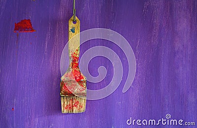 Paintbrush on purple background Stock Photo