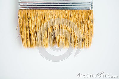 Paintbrush on the white background with copy space. Whitewashing brush, close up Stock Photo