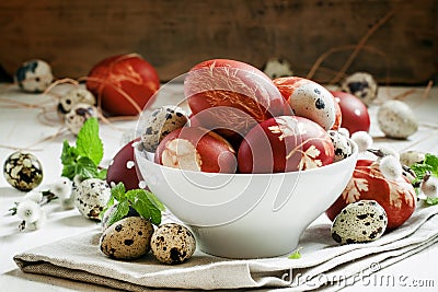 Painted brown Easter egg with a pattern, quail eggs, twigs of wi Stock Photo