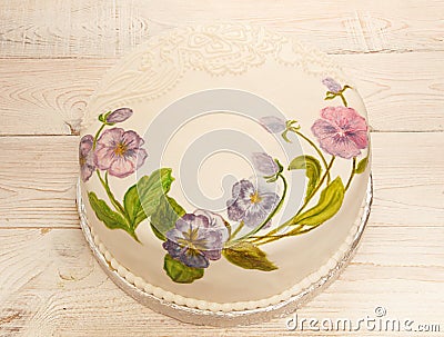 Painted cake fondant with food coloring. Cake with painted viola Stock Photo