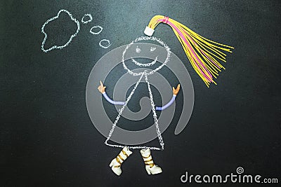 Painted with chalk character thinks on a blackboard Stock Photo