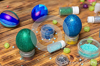 Painted easter glitter eggs, cans, sweets on table, food photography Stock Photo