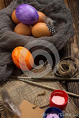 Preparation for coloring Easter eggs on a wooden table Stock Photo