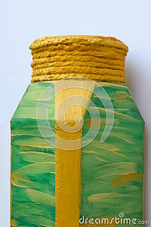 Painted with gold and red paint glass jar of coffee. It turned out to be colored vase. Stock Photo