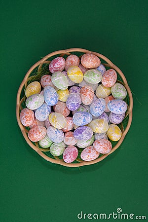 Painted little eggs in a basket Stock Photo