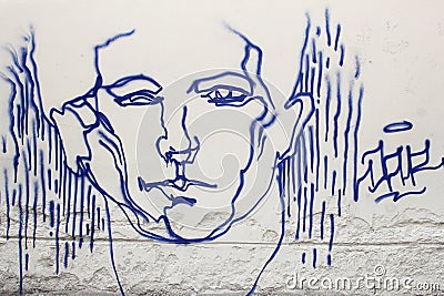 Street art of a male face in the Old town of Vilnius, Lithuania Editorial Stock Photo