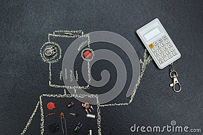 Painted robot with electric parts is holding a calculator Stock Photo