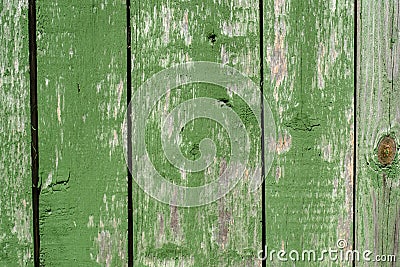 Painted vibrant green old faded wooden planking background with flaws Stock Photo