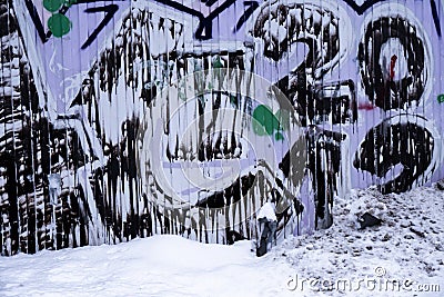 Graffiti on the wall in snow Stock Photo