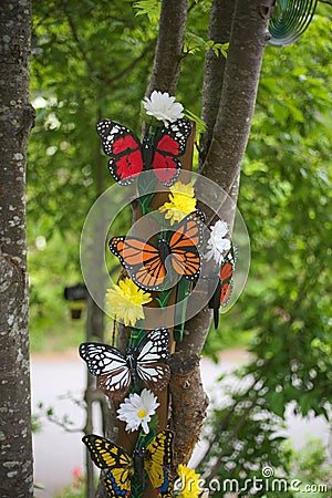 Painted wooden butterflies used as outdoor decorations Stock Photo