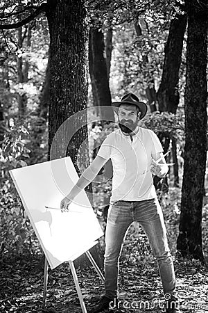 Painter artist forest. Art concept. Painting in nature. Start new picture. Painter with easel and canvas. Capture moment Stock Photo