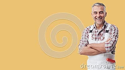 Painter and decorator smiling at camera Stock Photo