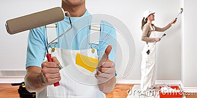 Painter hand with painting roller Stock Photo