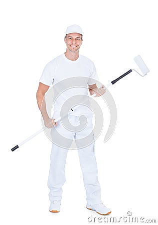 Painter holding paint roller Stock Photo