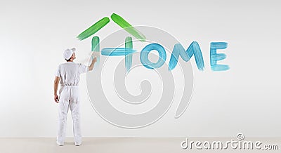 Painter man with paint brush painting home text word isolated Stock Photo