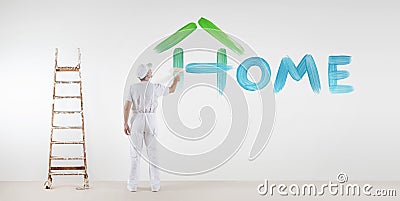 Painter man with paint brush painting home text word isolated Stock Photo