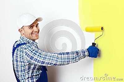 Painter painting a wall Stock Photo