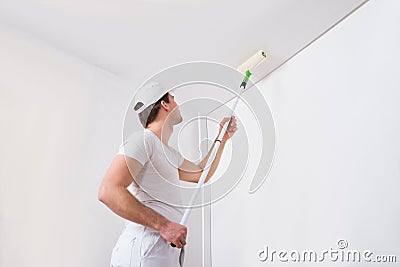 Painter Painting On Wall Stock Photo