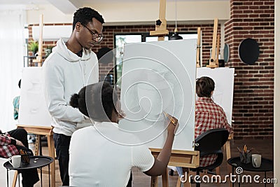 Painter teacher explaining illustration technique to student Cartoon Illustration