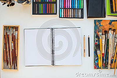 Painter workplace in order side view. Designer desk with drawing equipment. Home studio for artist Stock Photo