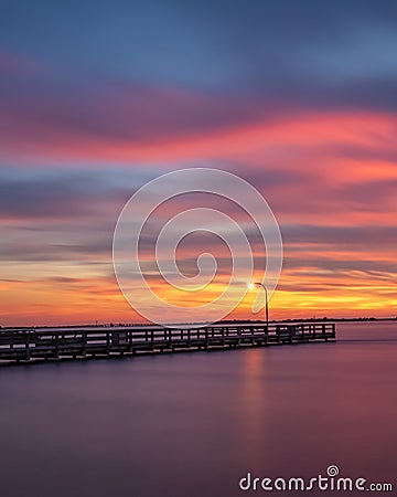 Painterly sunset over fishing pier Stock Photo