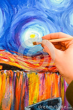 Painting brush, hand and oil canvas, artist`s hand, Acrylic and Full spectrum on Cardboard, Van Gogh The Starry Night Stock Photo