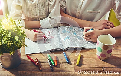 Painting a coloring book Stock Photo