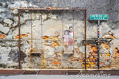 The painting of a couple of Children on a Swing at George Town, Editorial Stock Photo