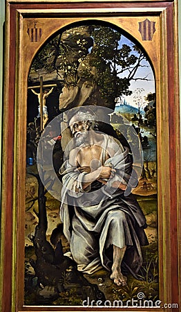 Painting depicting an elderly hermit praying at the foot of a small crucifix attached to a shrub, at the Uffizi museum in Florence Editorial Stock Photo