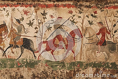 This painting depicts a scene of men riding on horses, with one man standing out as he rides on a horse, A medieval hunting party Stock Photo