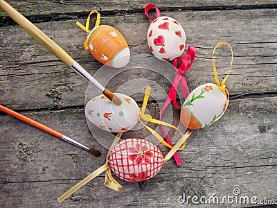 Painting Easter eggs on wooden background Stock Photo