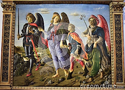 Painting located in the Uffizi museum in Florence, depicting a peaceful scene, three angels walk with a boy with protective air. Editorial Stock Photo