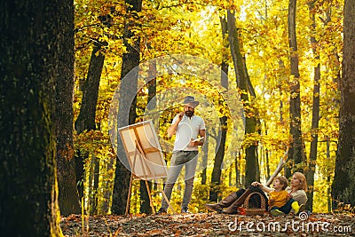 Painting in nature. Start new picture. Capture moment. Beauty of nature. Bearded man woman and son relax autumn nature Stock Photo