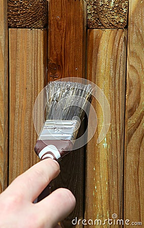 Painting wooden furniture piece Stock Photo