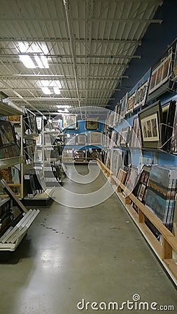 Paintings on shelves selling Editorial Stock Photo