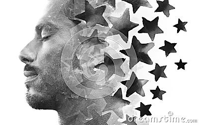 Paintography. Double exposure of a young male model combined with hand drawn painting of repeating black stars Stock Photo