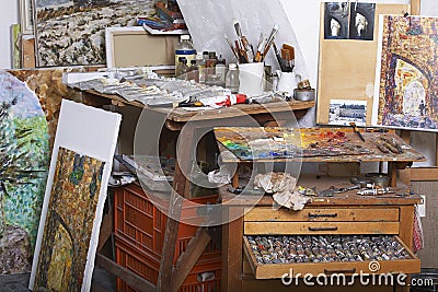 Paints and Canvases in Artist`s Studio Editorial Stock Photo