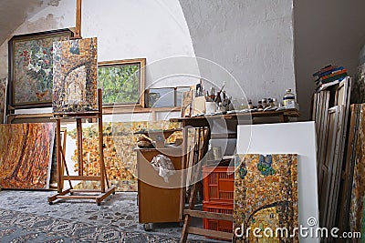 Paints and Canvases in Artist`s Studio Editorial Stock Photo