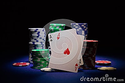 Pair of aces and poker chips on black background Stock Photo