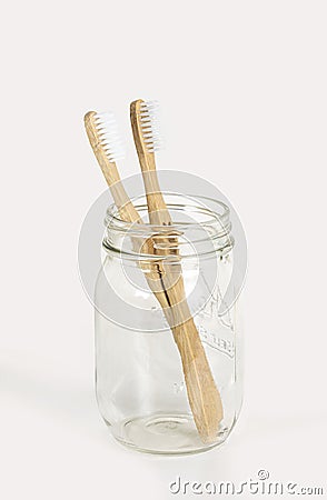 A pair of bamboo toothbrushes on a light background Stock Photo