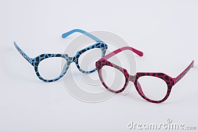Pair of blue and pink plastic eyeglasses with spotted design Stock Photo