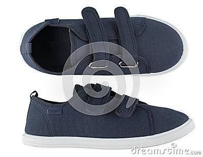 Pair of blue sporty sneakers, gumshoes for boy isolated on a white background, close up, top view Stock Photo