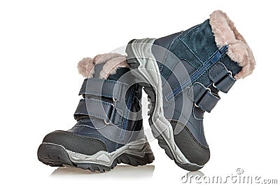 A pair of boots for winter snowy weather, insulated with fur, waterproof, shoes for children, on a white background Stock Photo