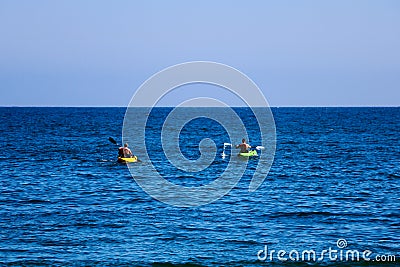 A pair of canoes in the Pacific. People kayak in the ocean Stock Photo