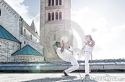 Pair of capoeira performers doing a kicking Stock Photo