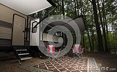 Pair of chairs at a campter trailer campsite Stock Photo