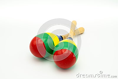 A pair of colorful maracas lying on a white underground Stock Photo
